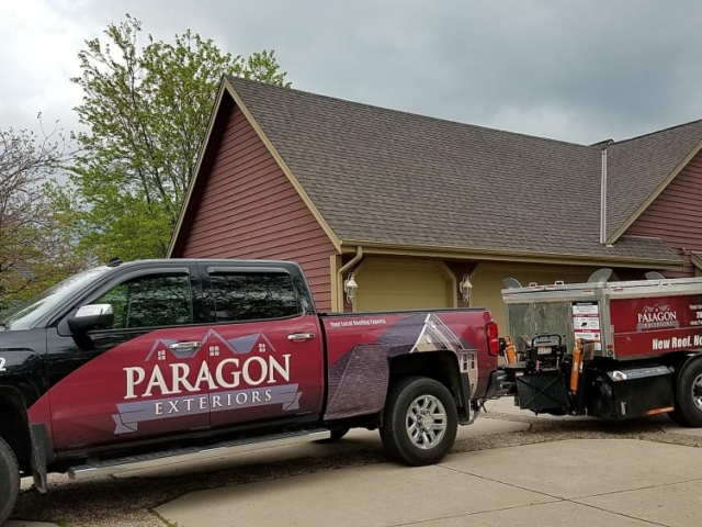 Paragon Exteriors LLC Truck and Trailer On-Site In Brookfield Wisconsin.