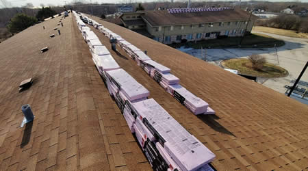 Roofing Shingles On Roof Waiting For Replacement